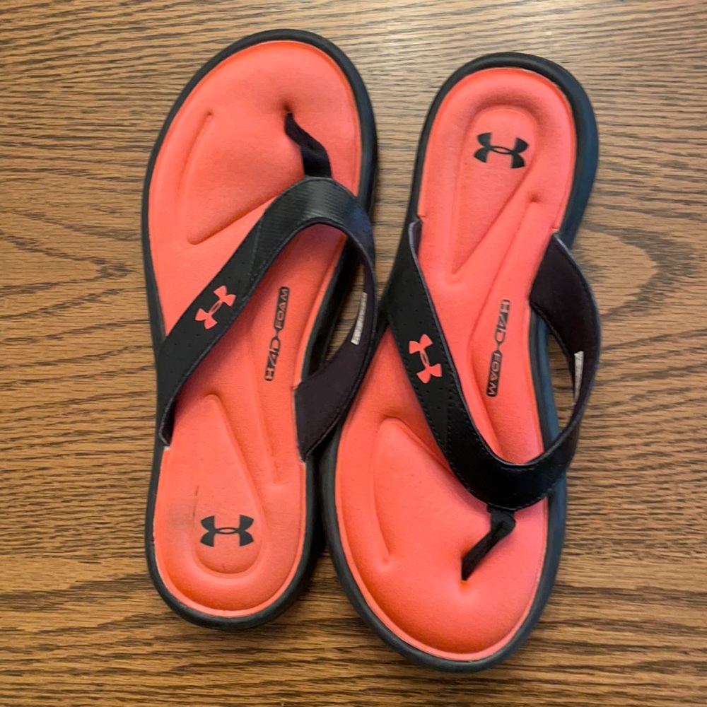 Black and hot pink under armor flip flops